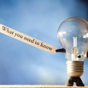 Lightbulb holding What you need to know sign