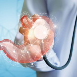 Doctor with stethoscope checks stomach