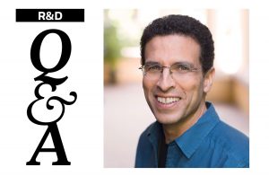 Man smiling at camera and Q&A header