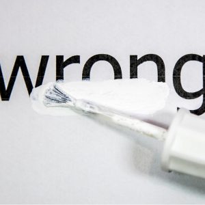 Word 'wrong' with white out over it