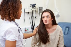Doctor comforting patient