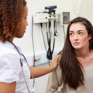 Doctor comforting patient