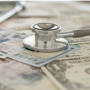 Stethoscope on hundred dollar bill