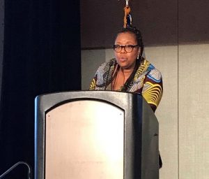 Woman speaking at podium