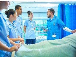 Doctor teaching other medical professionals