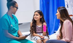 Doctor with stethoscope speaking to patients