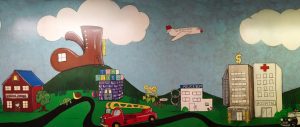 Drawing of school house, toy store, fire truck, police department and hospital