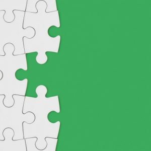 Green background with white puzzle pieces