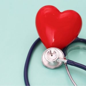 Sea foam green background with red heart and stethoscope