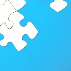 Blue background with white puzzle pieces