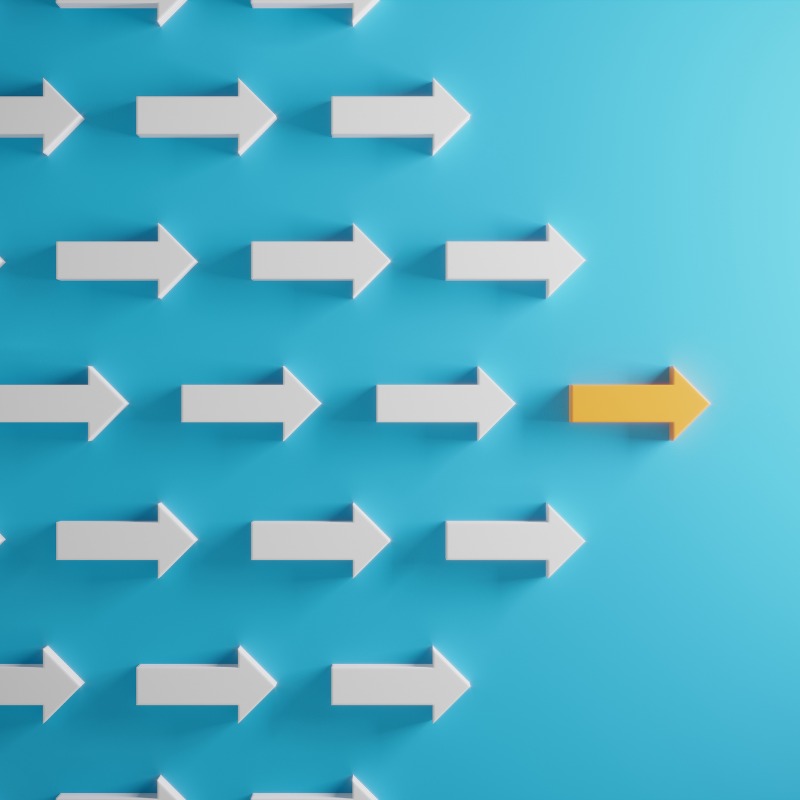 Blue background with multiple arrows pointing right