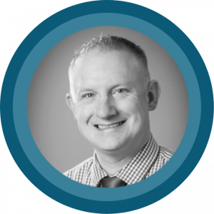Black and white headshot of Kevin Gallagher