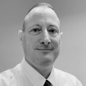 Black and white headshot of Craig Dreher